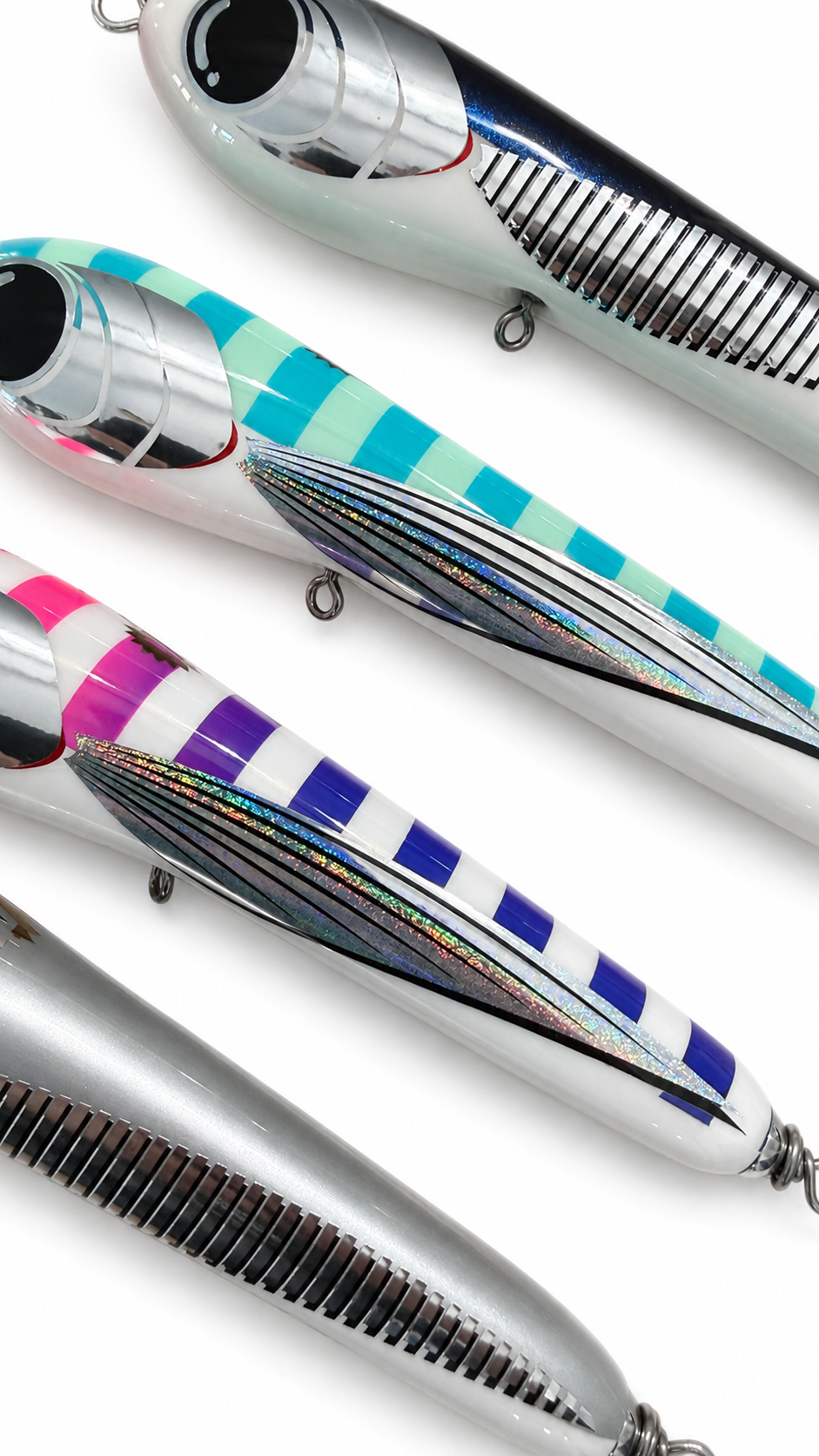 Close-up of Volcanic Lures Offering 210 stickbaits showing detailed finishes in Tropical Pilotfish, Green Flying Fish, Maziora and Silver Pearl colourways.